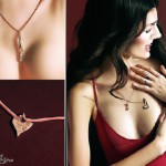 "prompt": "Create a stylish and modern advertisement photo for a luxury jewelry brand named 'Tehrani Gold'. The concept should be playful, bold, and fashion-forward, blending everyday lifestyle elements with elegant gold jewelry such as necklaces, earrings, or rings. The focus should be on a woman with minimal makeup but striking red lipstick, posing creatively (for example, making a fish face or holding pastries, fruits, or coffee cups) to add a fun and human touch. The jewelry should appear r